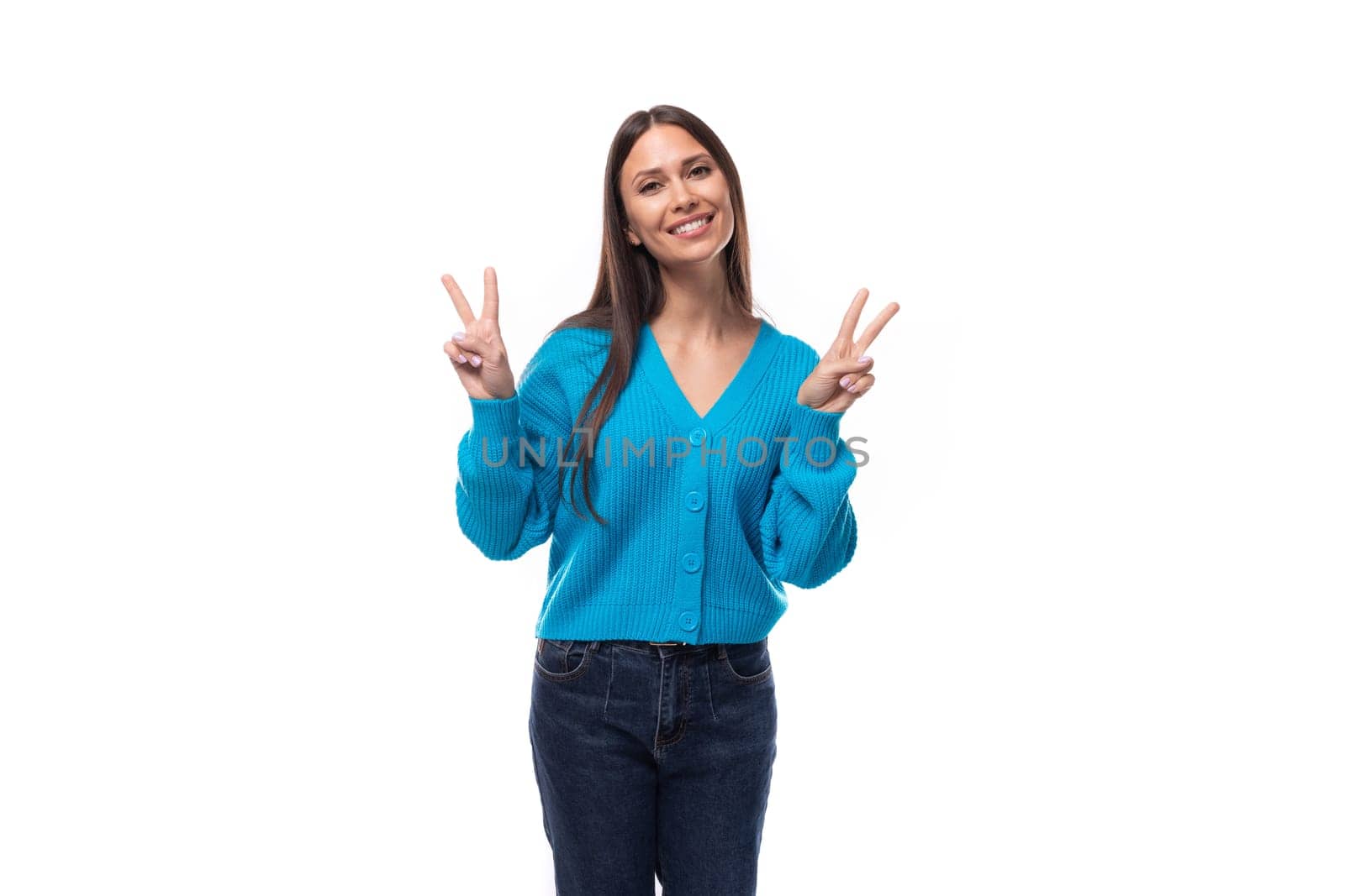 positive young brunette woman dressed in a blue cardigan with buttons by TRMK