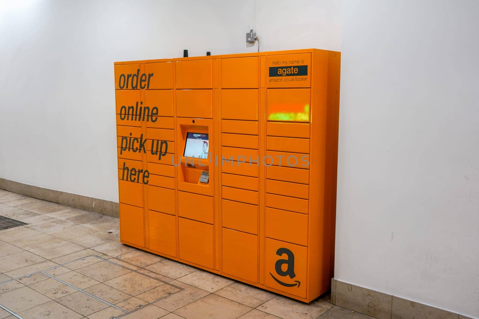 London, United Kingdom - February 03, 2019: Orange Amazon locker in Lewisham shopping centre. Service is used for pick up of orders delivered from on-line store