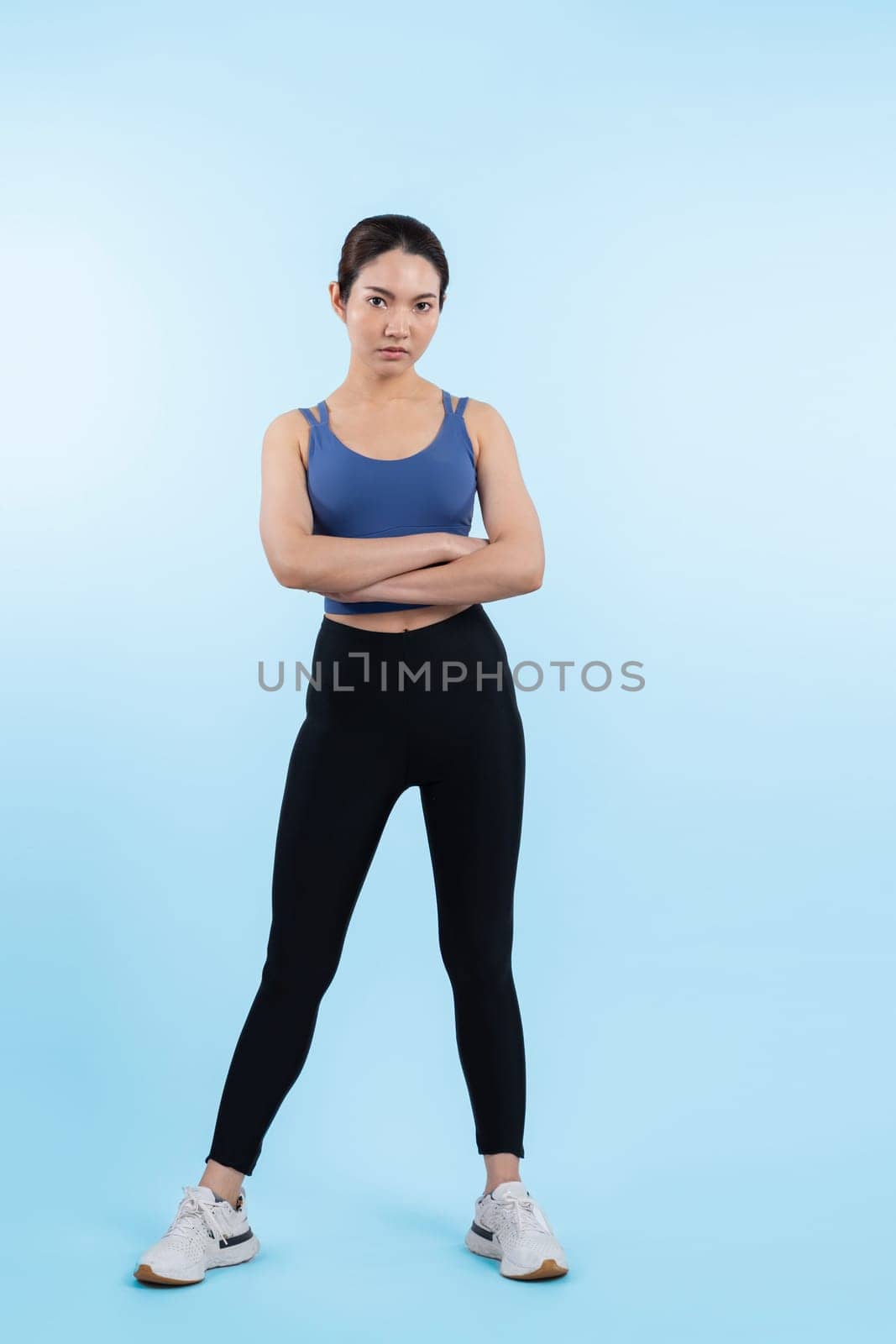 Full body asian woman in sportswear portrait, smiling and posing cheerful gesture. Workout training with attractive girl engage in her pursuit of healthy lifestyle. Isolated background Vigorous