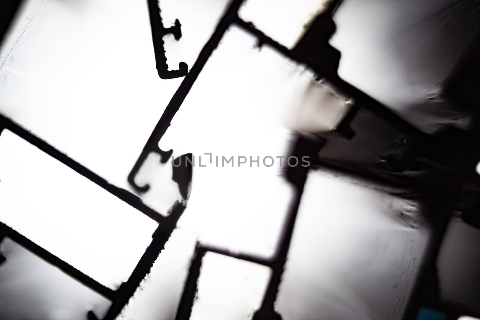 Steel factory warehouse displayed aluminum profile for window, door, bathroom box with blurry background, used as a background or texture, soft focus