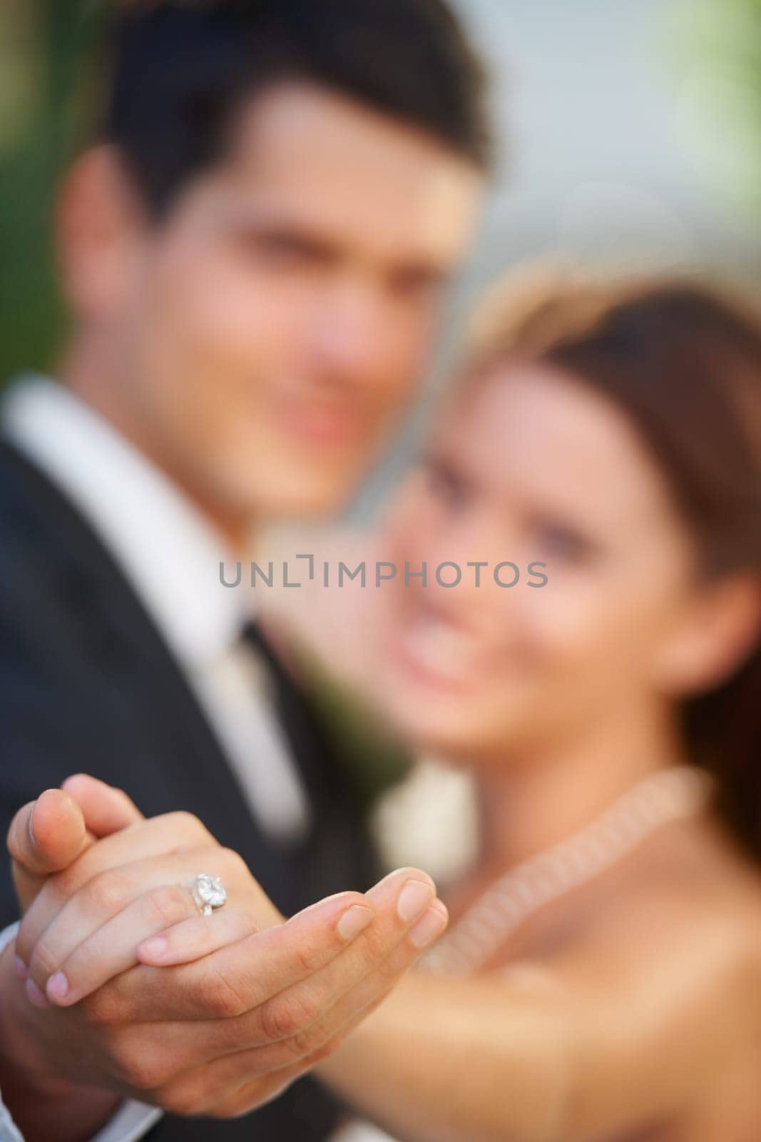 Hands, ring and a couple on their wedding day for love, romance or celebration at a marriage ceremony. Trust, commitment or promise with a bride and groom together at an event to get married closeup.