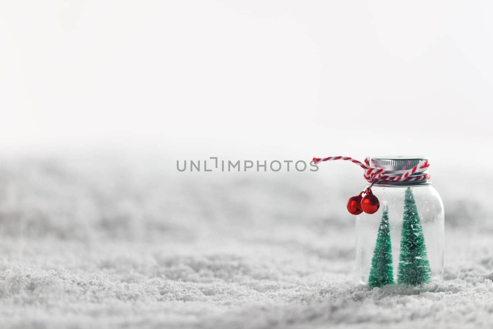 Christmas ornaments on snow by Yellowj