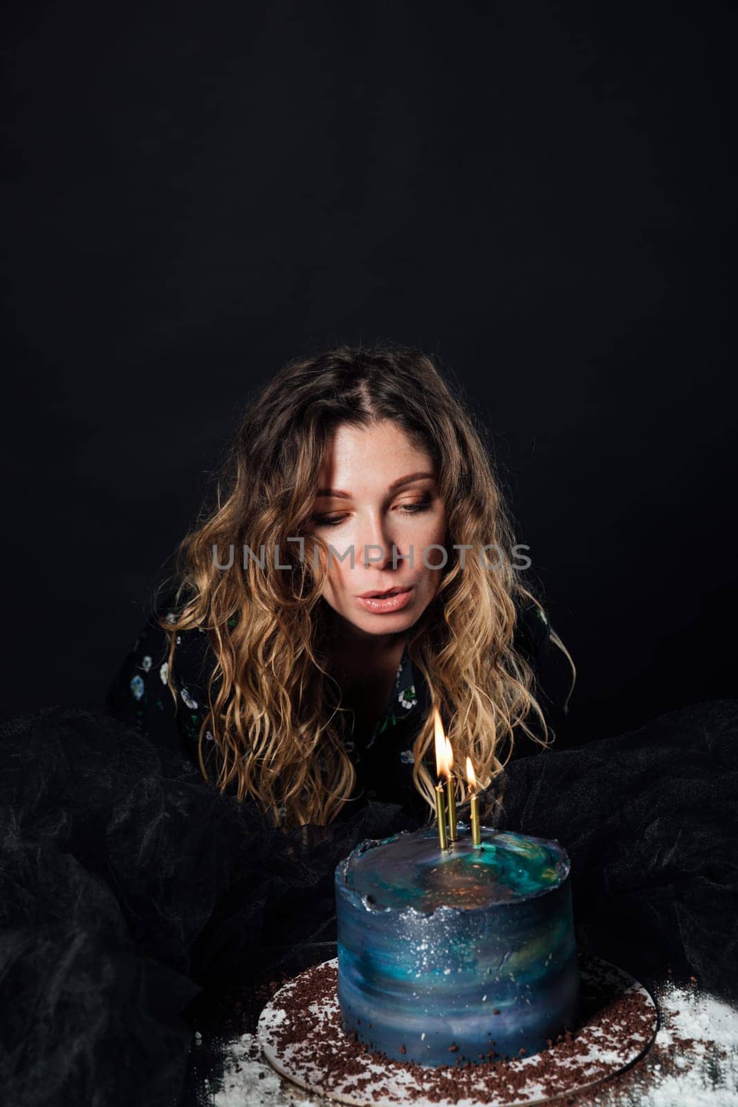 birthday woman blows candles on cake dessert delicious sweets by Simakov