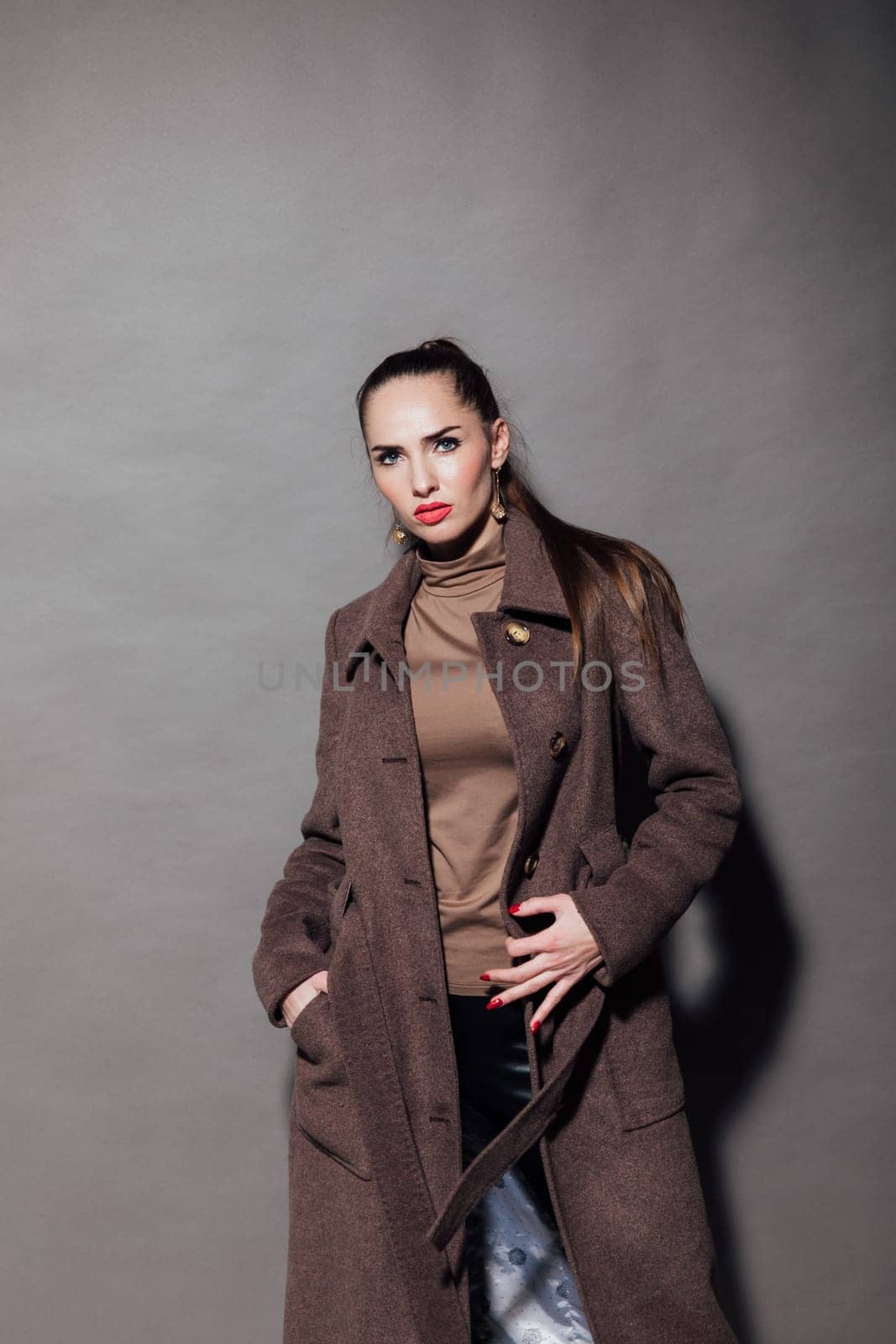 woman brunette in brown cape posing fashion by Simakov