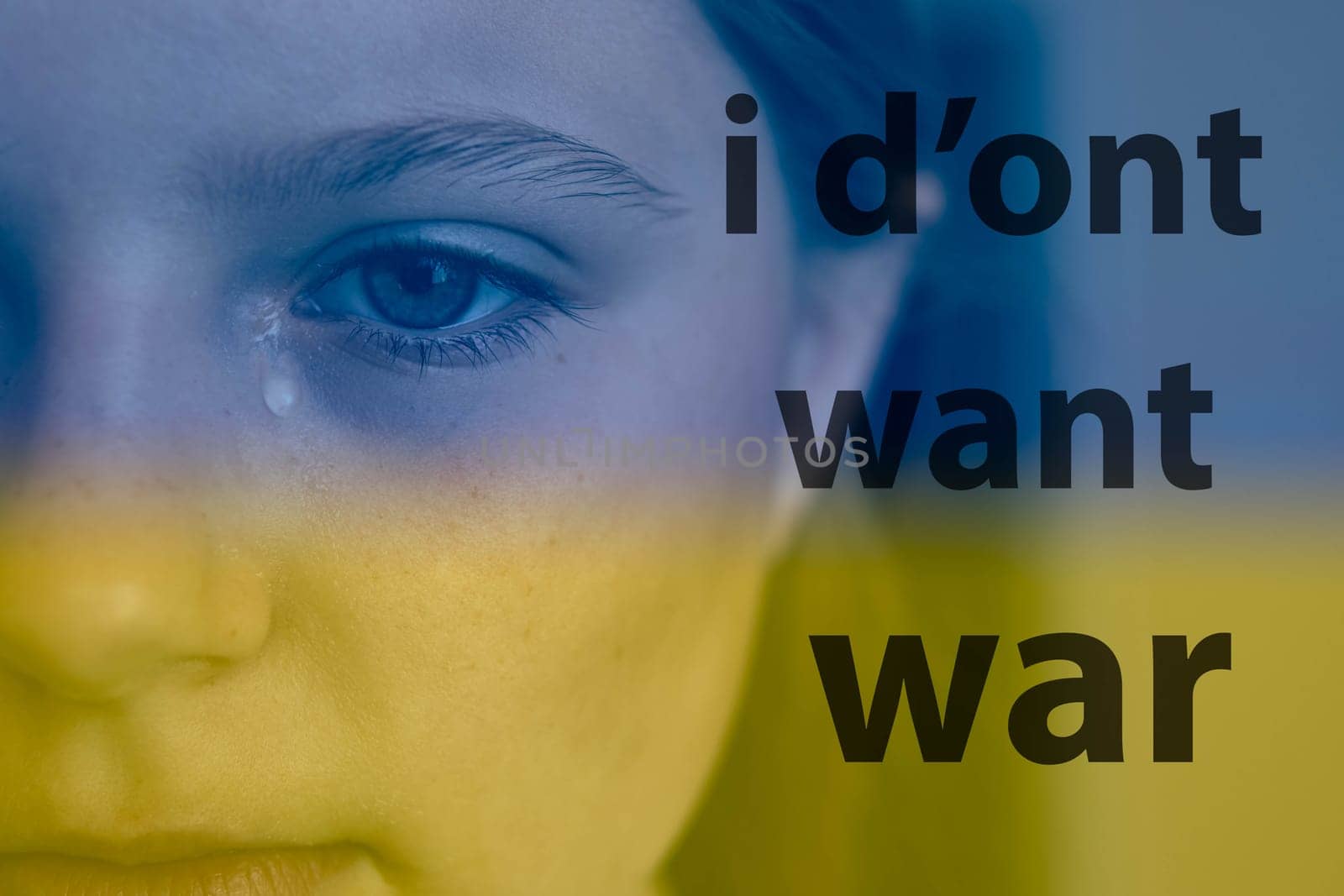 ukrainian baby girl cryingn on the right is the inscription I don't want war in black letters.Ukraine flag background blue and yellow color background.Stop the war in ukraine. High quality photo