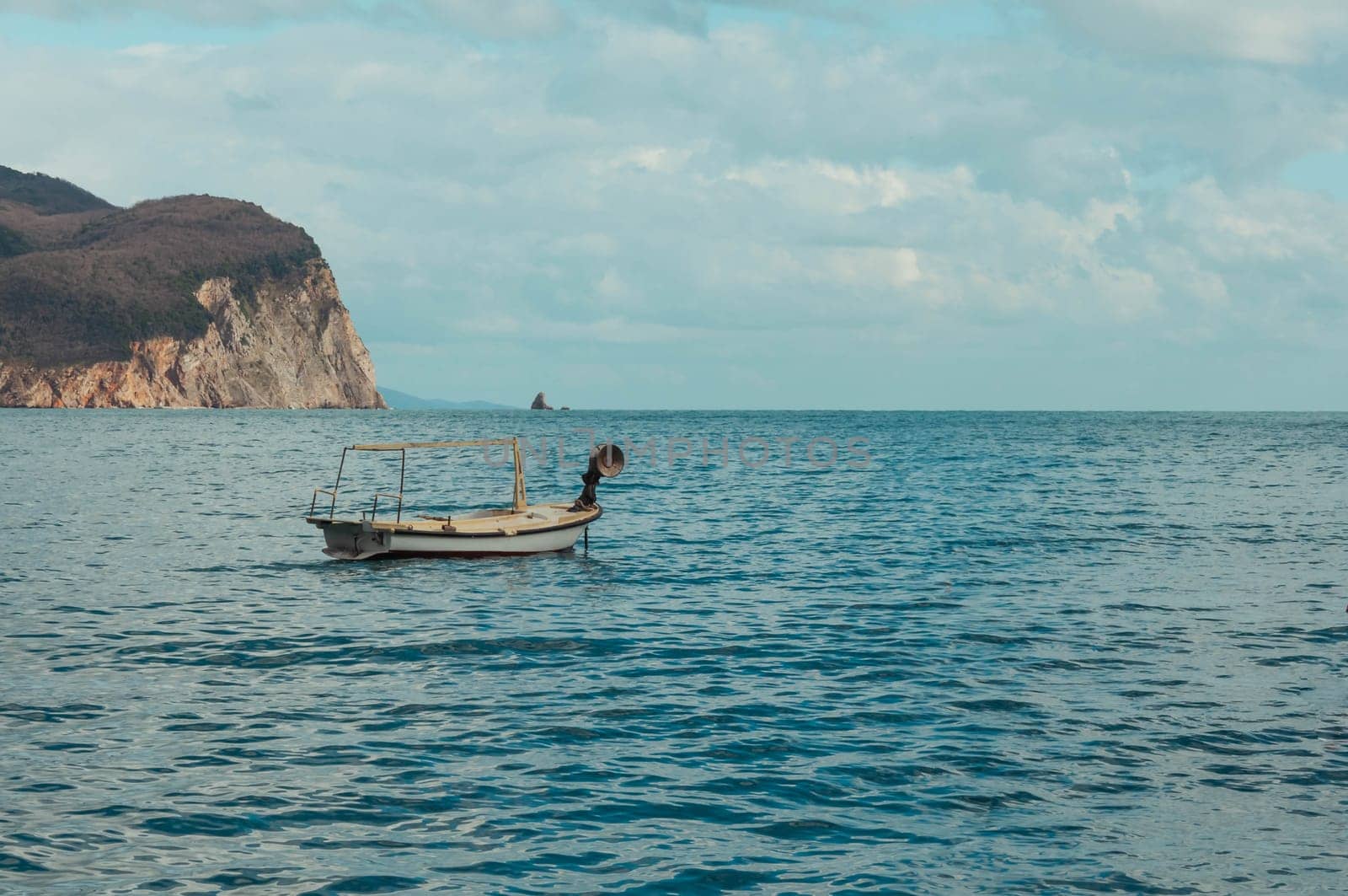 a boat without anyone stands in the sea, a beautiful seascape with a place for an inscription, a marine background. High quality photo