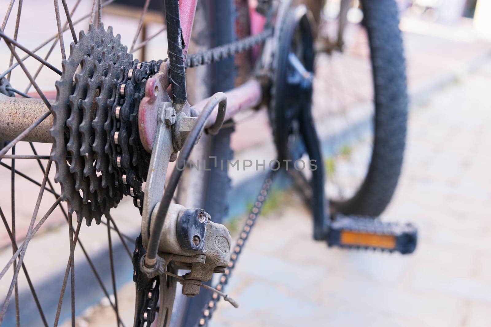 rear wheel close-up. A small sprocket on a bicycle rear derailleur. Details of the bicycle wheel speed switch. concepts of repair, sports, cycling, outdoor activities. High quality photo