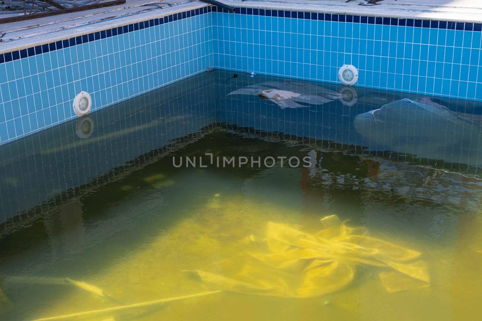 outdoor pool repair,dirty water,outdoor pool cleaning after winter. High quality photo