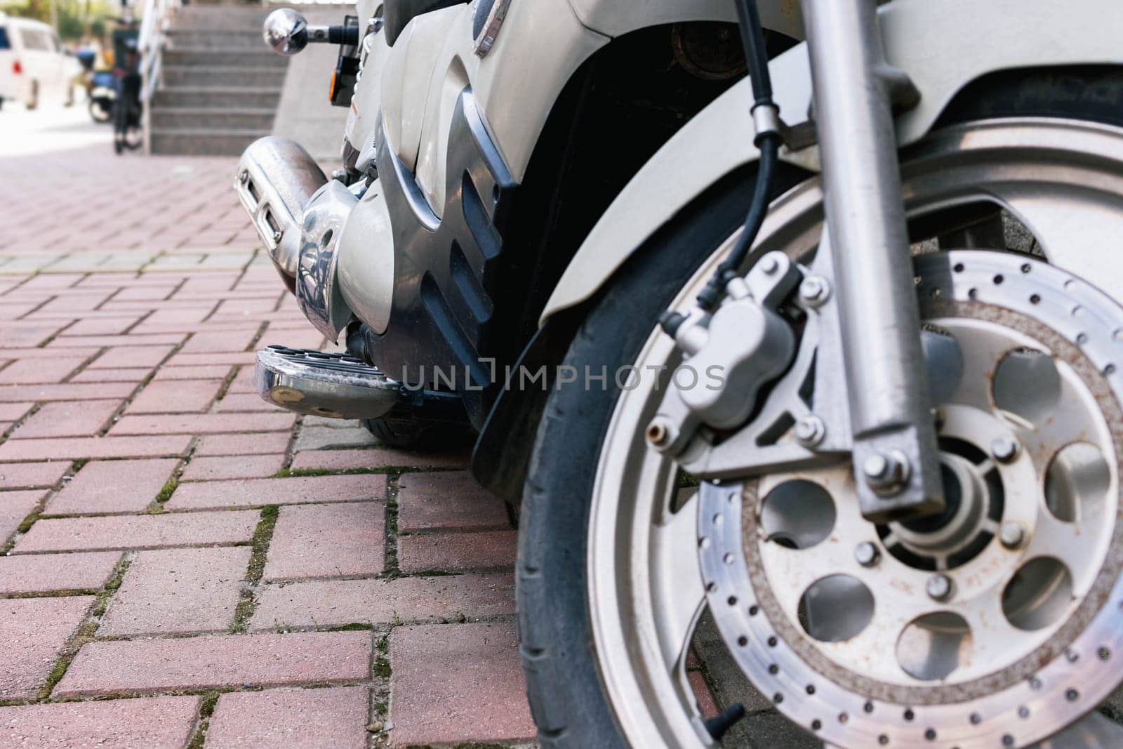 new motorcycle with metal parts and big wheels, bottom view. High quality photo