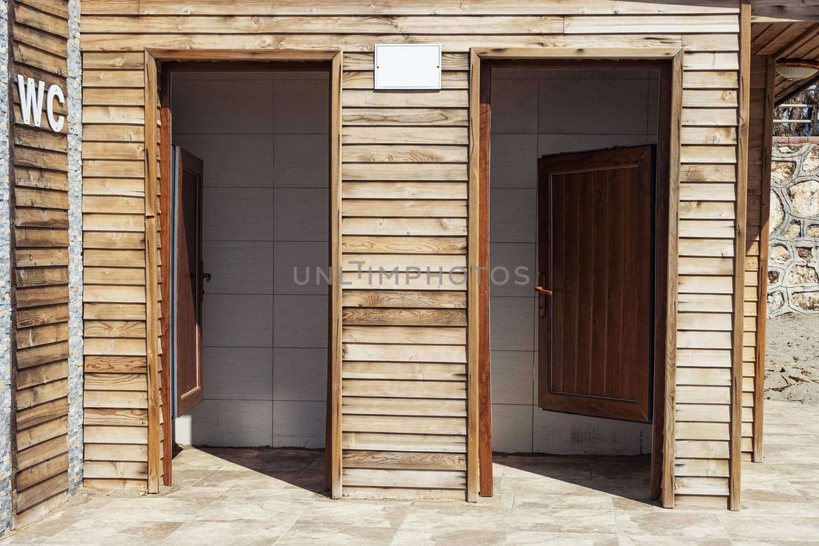 Wooden toilet on the beach.Close-up of the toilet sign on the beach toilet. High quality photo