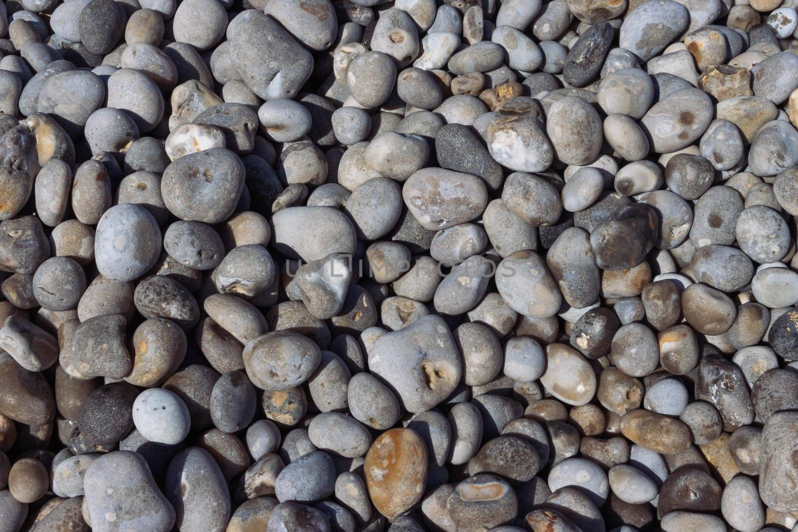 Pebble stone or river stone background with a place for an inscription.beach on the sea close-up. High quality photo