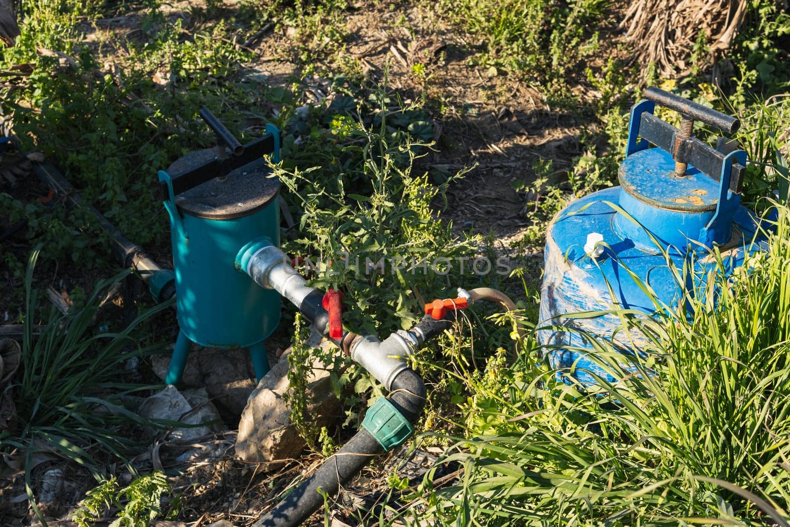 pump for water on a banana plantation to water the crop in the heat High quality photo