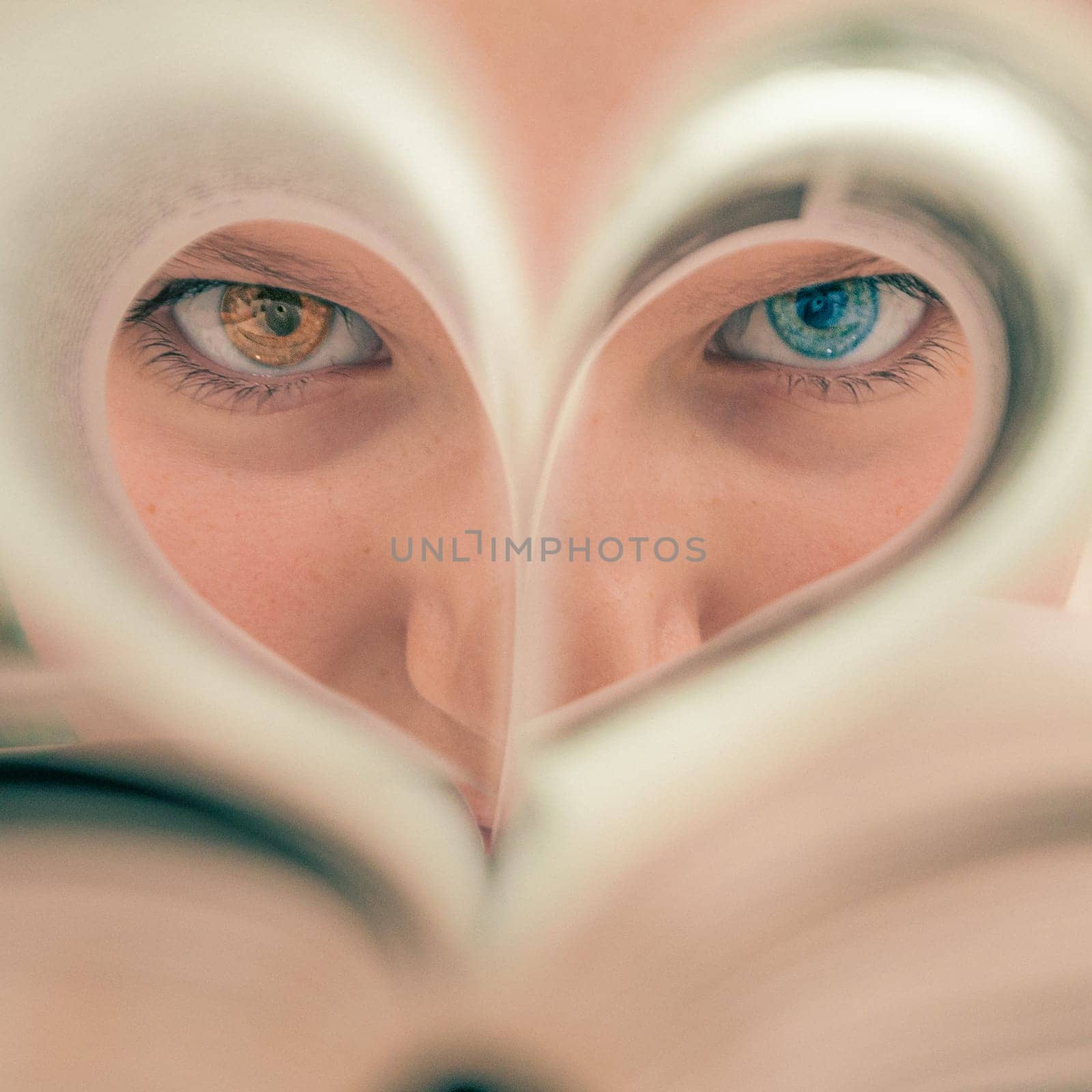 close-up girl's face with different eye colors, green and brown eyes. Heart-shaped eyes close-up, by PopOff