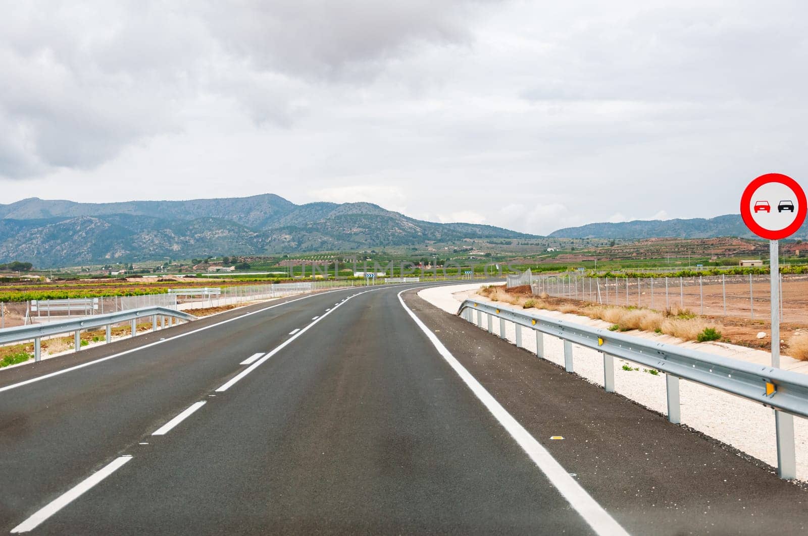 clean road without cars with a beautiful sky landscape nature, there is a place for an inscription by PopOff