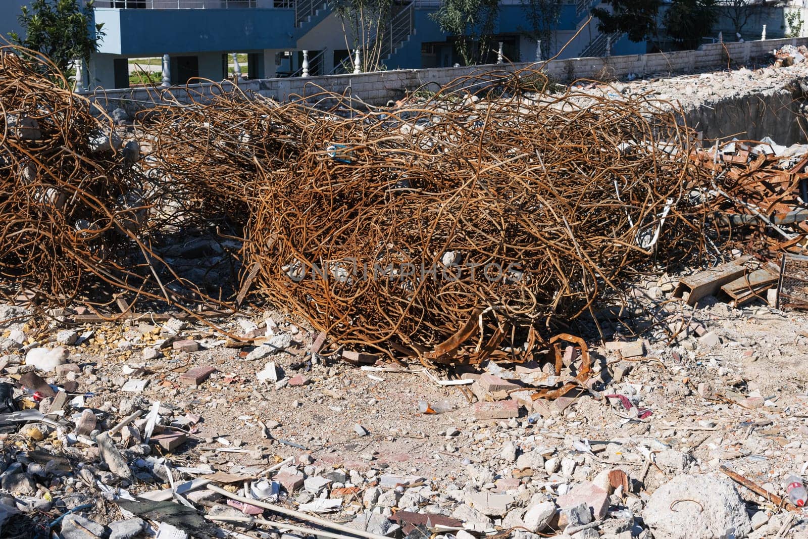 A fragment of old copper wire and sheet from a recycling company lies on the ground for wallpaper and background. High quality photo