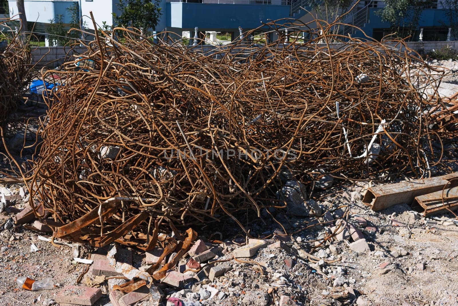 A fragment of old copper wire and sheet from a recycling company lies on the ground for wallpaper and background. High quality photo