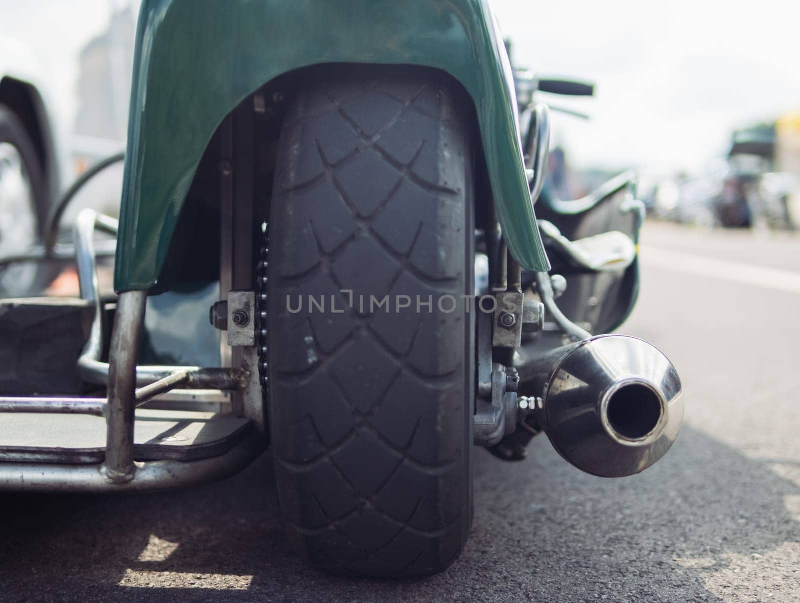 close-up of a wheel on a motorcycle rear view of the rear wheel by PopOff