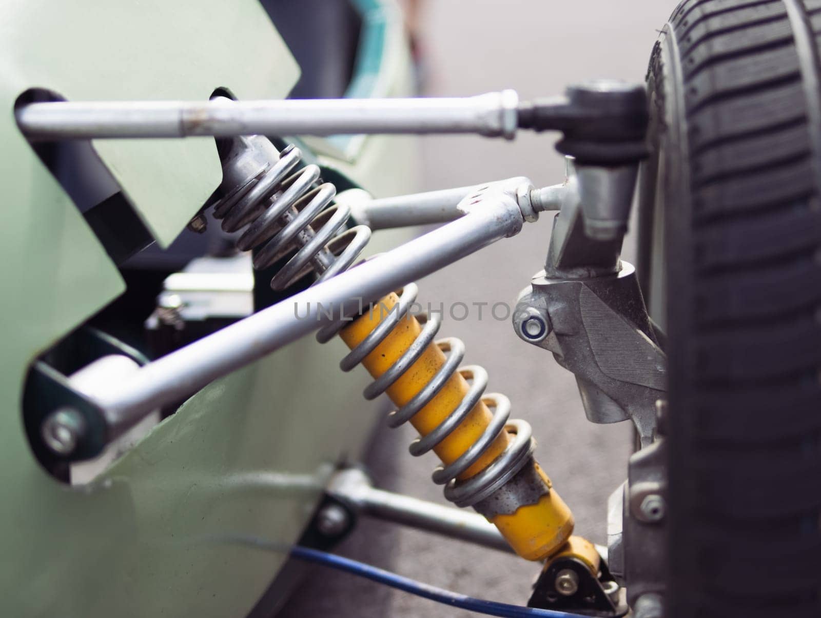 shock absorber and spring closeup on racing car isolated. High quality photo