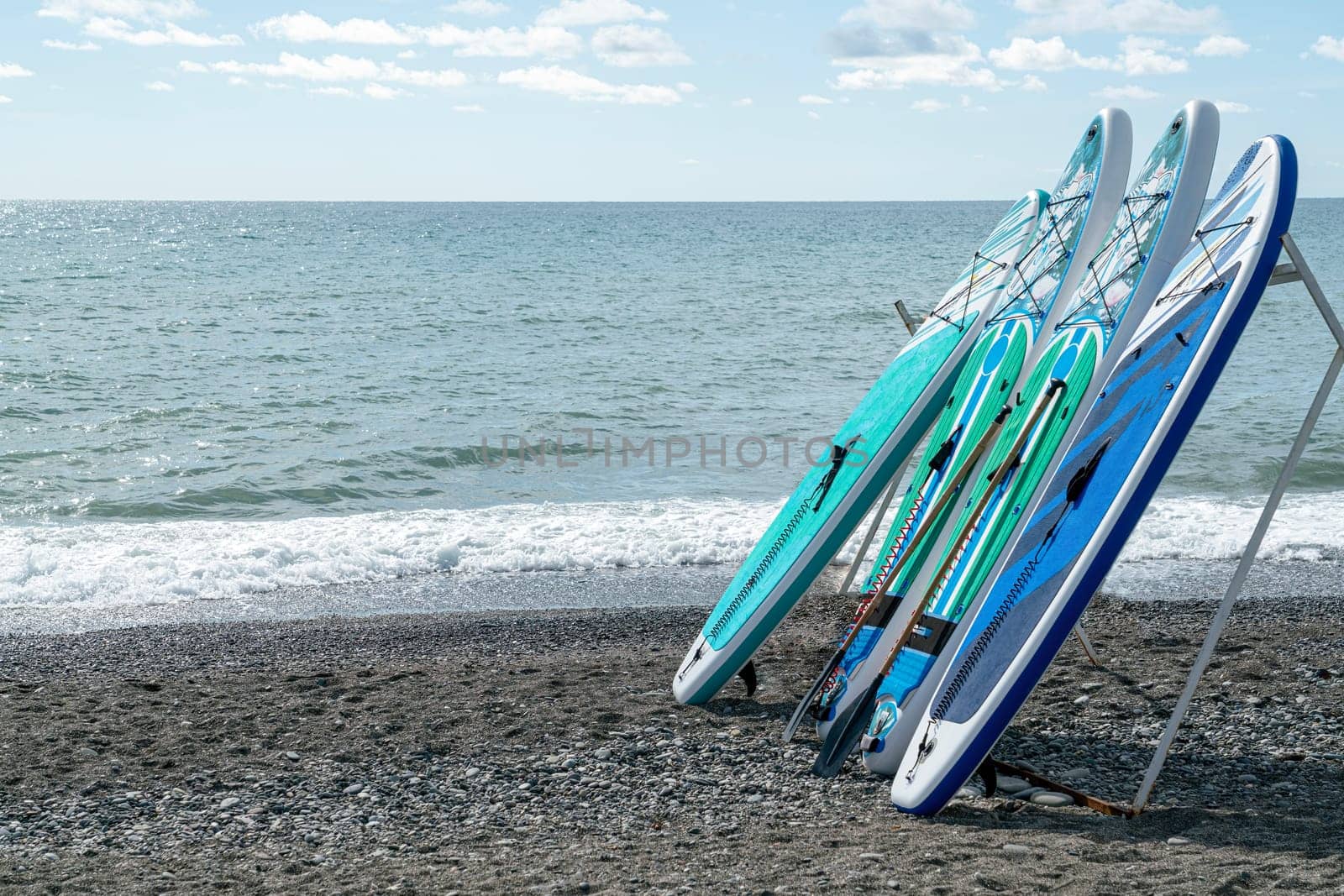 surfboards on the seashore against the blue sky. photo