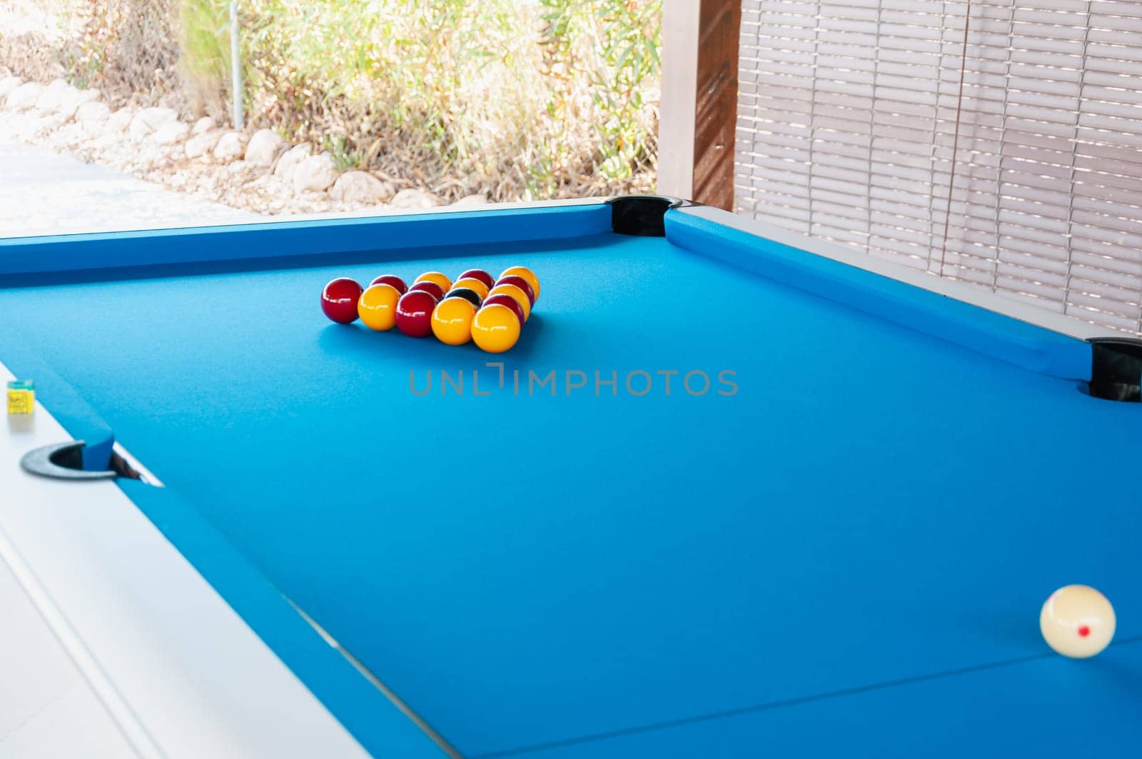 billiards outdoors, pool table on the street in the park, summer sports, leisure games outside. High quality photo