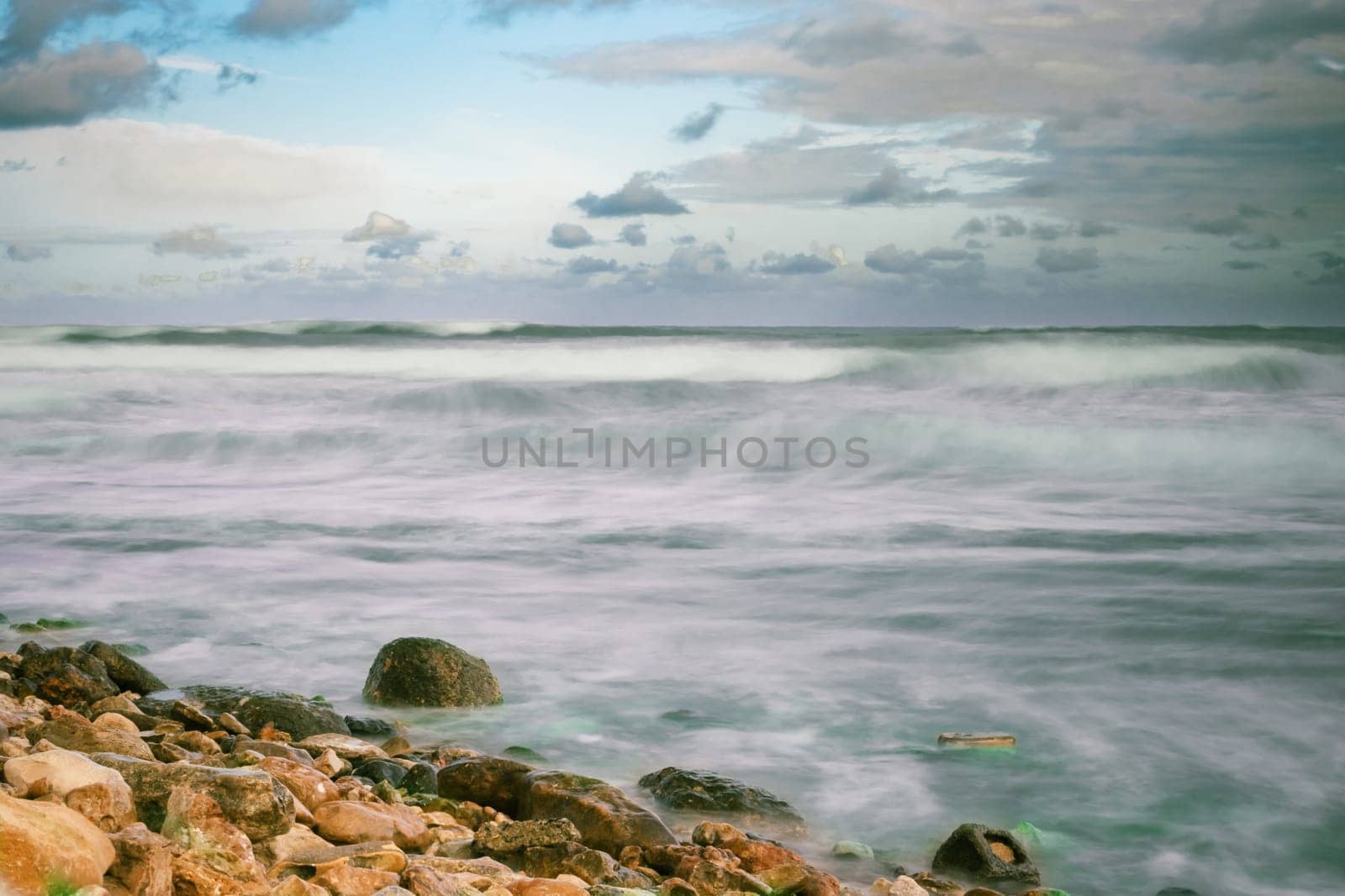 Beautiful view of the seashore,storm waves.Beautiful sea background. High quality photo