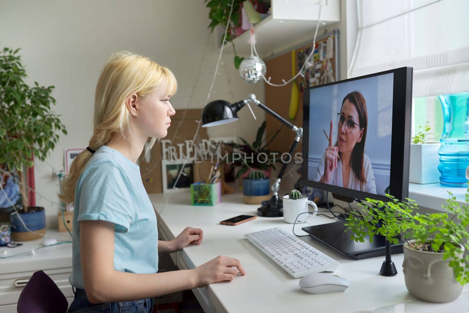 Online session of teenage girl and psychologist, social worker. Young female talking to therapist, teacher, at home looking at computer screen. Professional help, mental health, education, adolescence