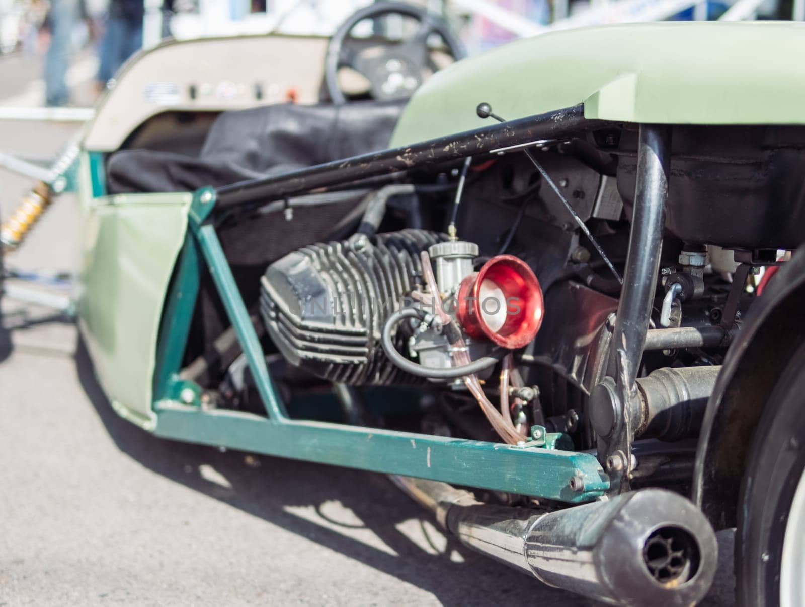 close-up of a motor on a rare racing car, a close-up of a green car. High quality photo