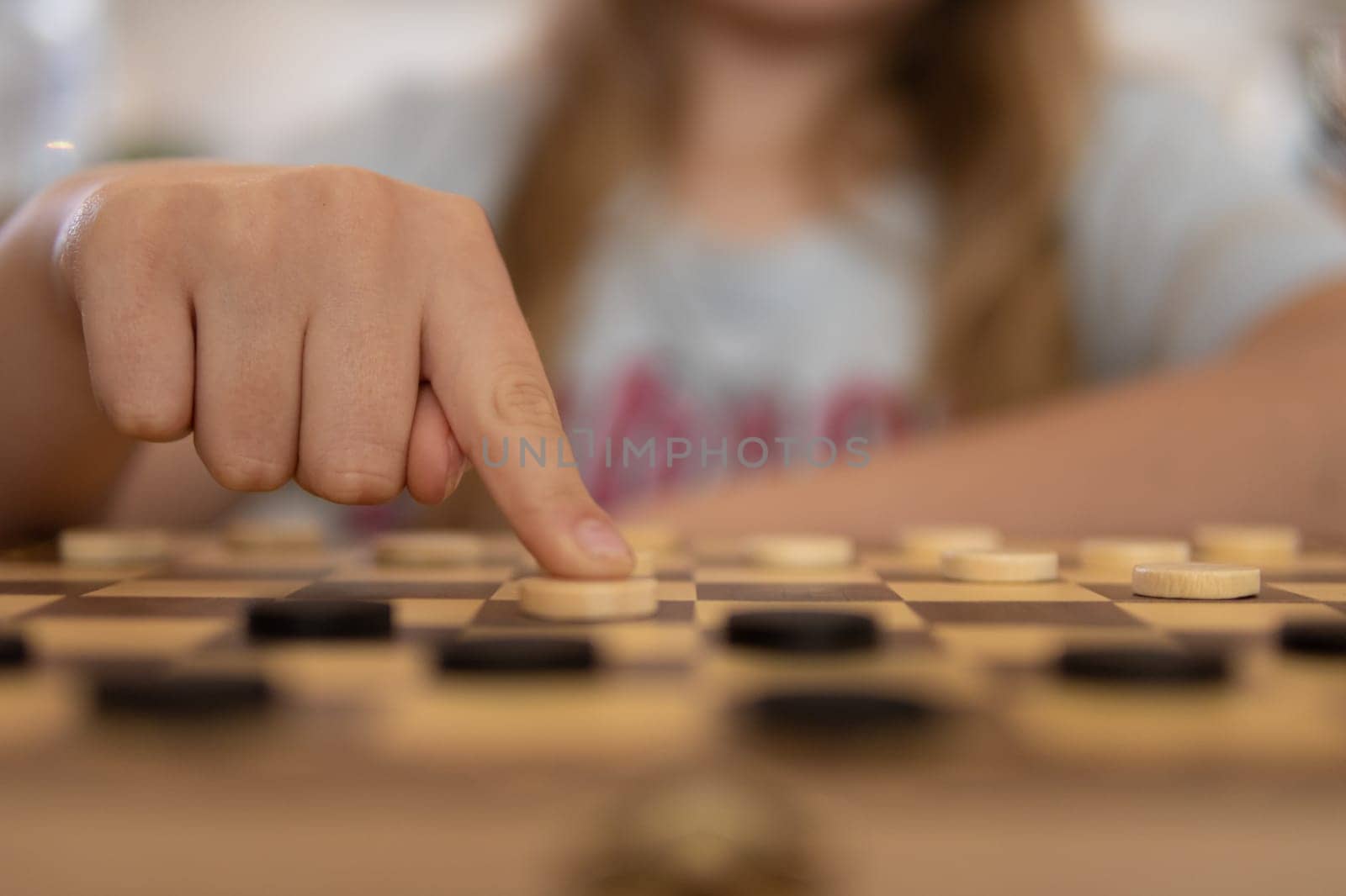 close-up view of a hand of elderly woman playing chess. High quality photo