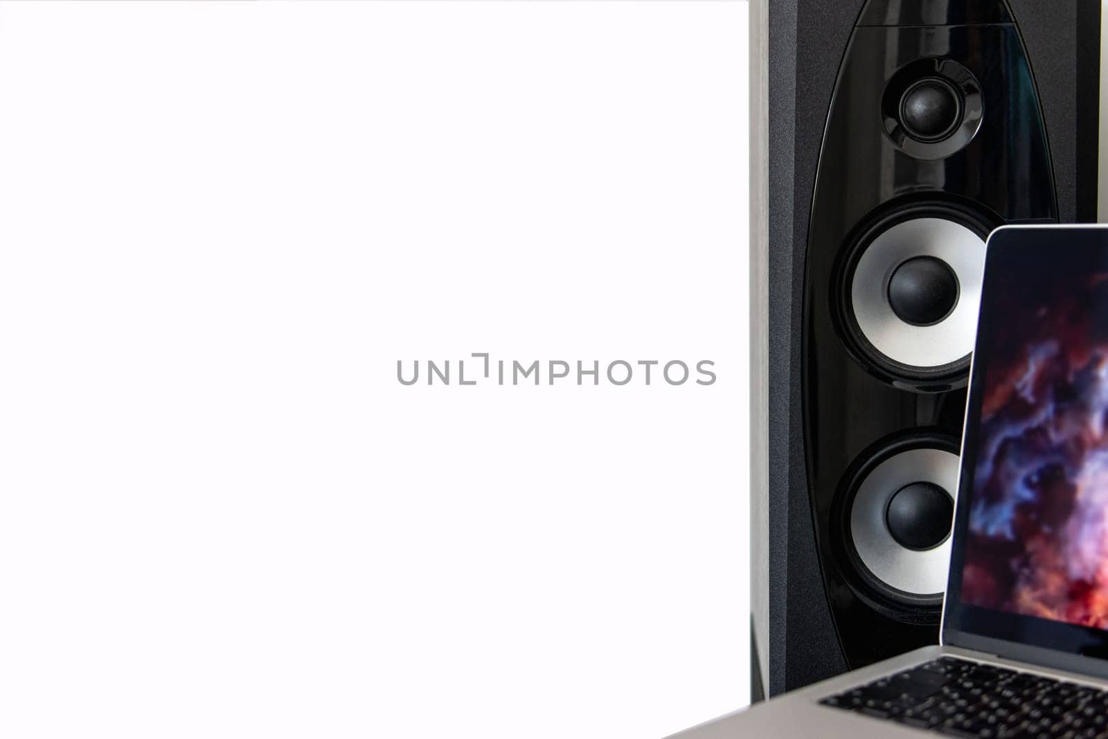 sound speaker and laptop with free space on white background. by PopOff