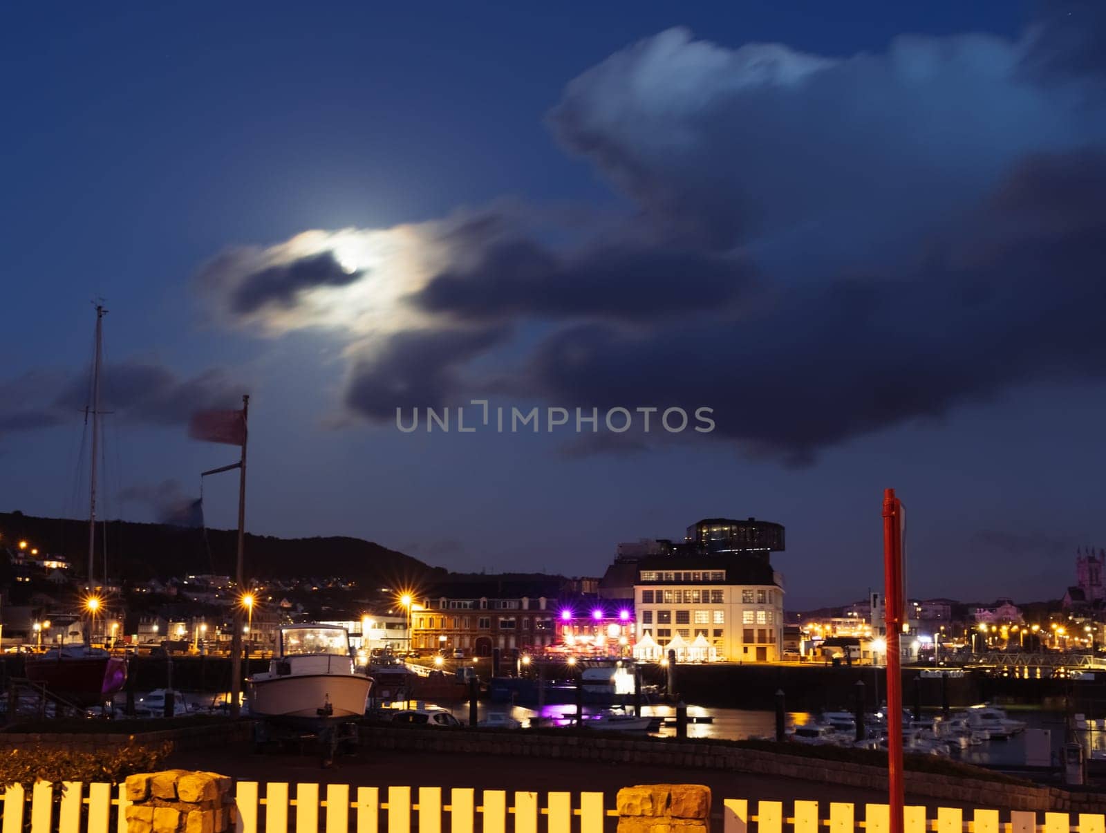 evening city from the height of the photo on the evening city and the sky. Beautiful evening landscape, lights are burning everywhere in the city. High quality photo