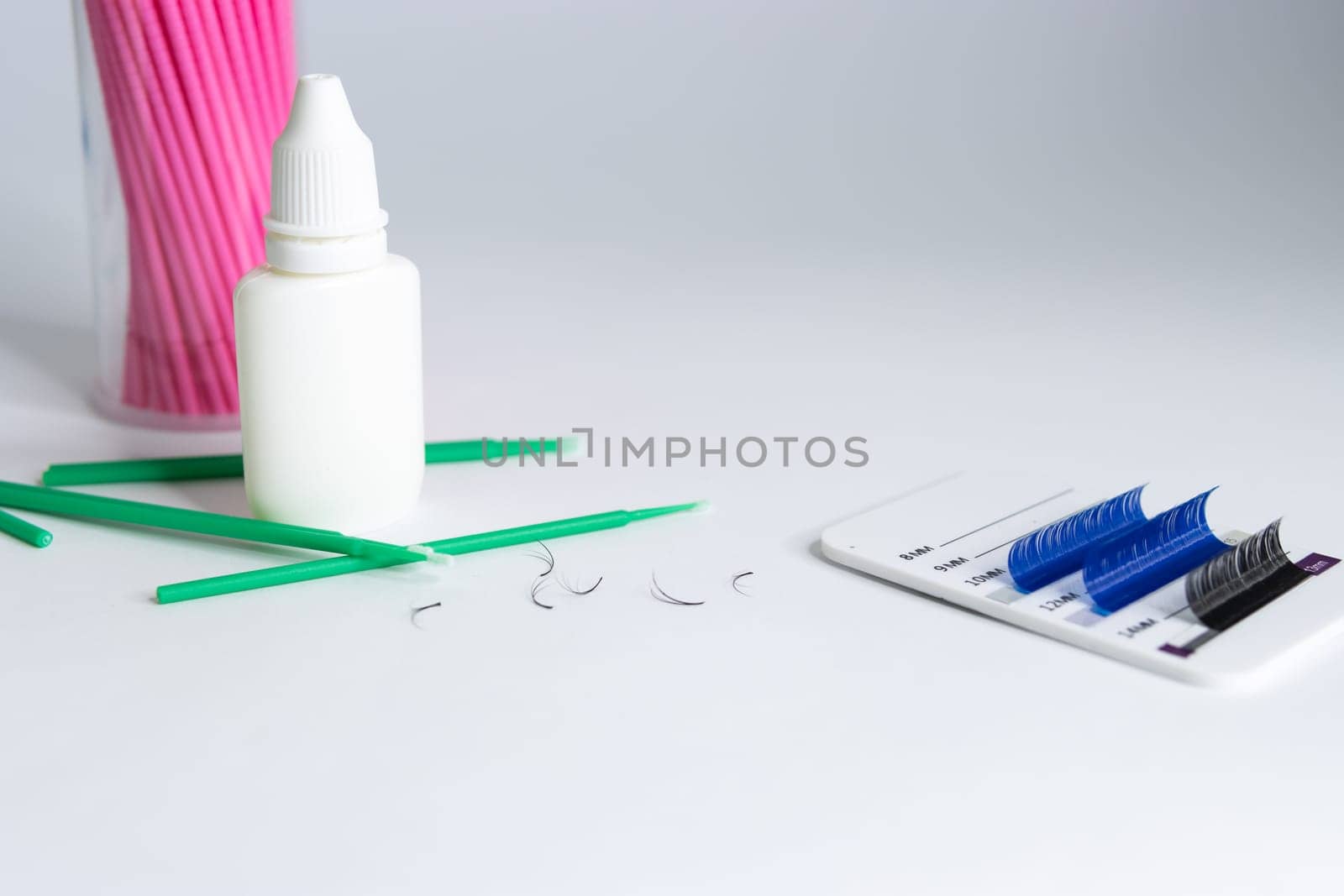 Artificial eyelashes in black and blue on a white background by PopOff