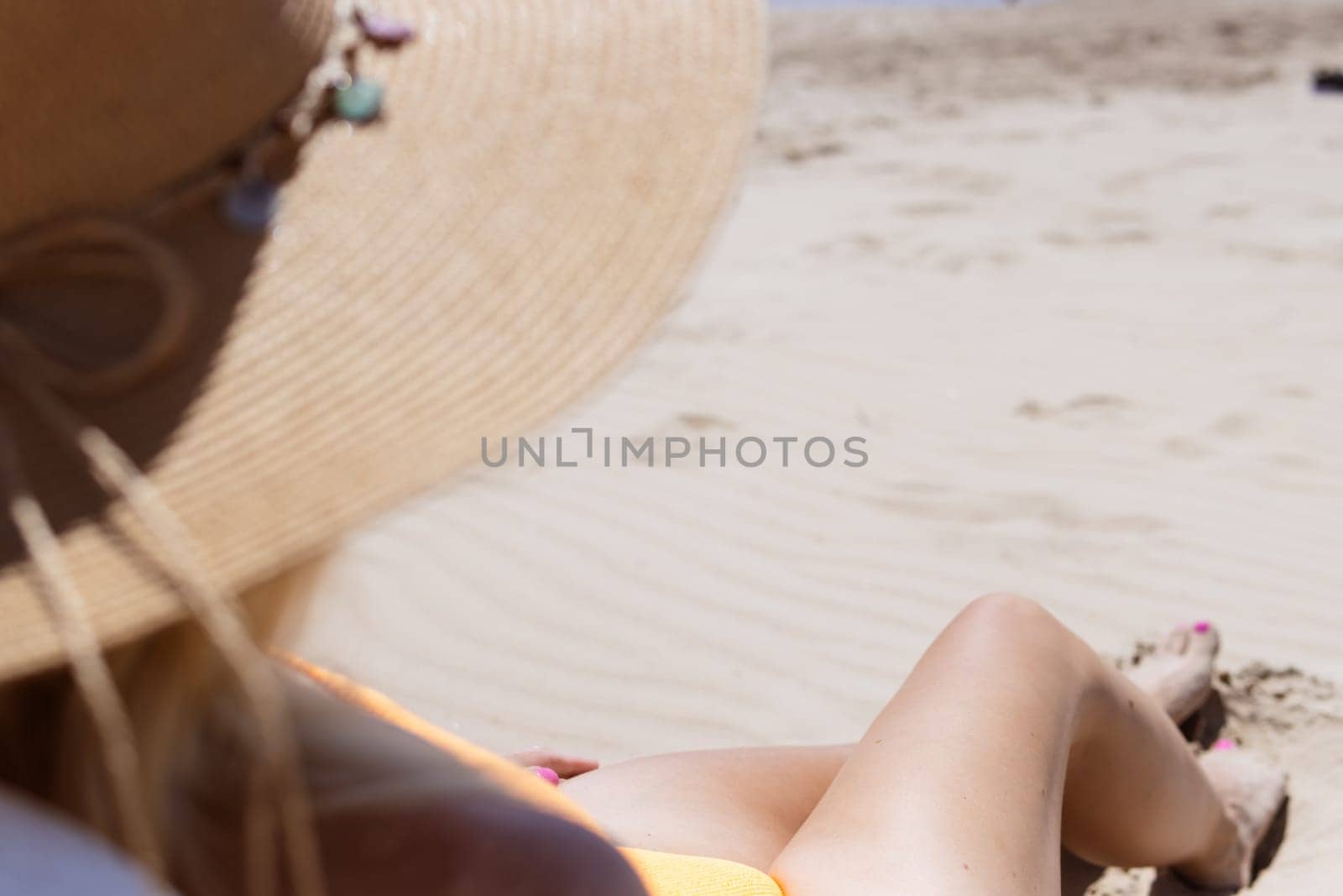 girl in a hat,close-up on the tanned and slender legs of a girl,there is a place for an inscription by PopOff