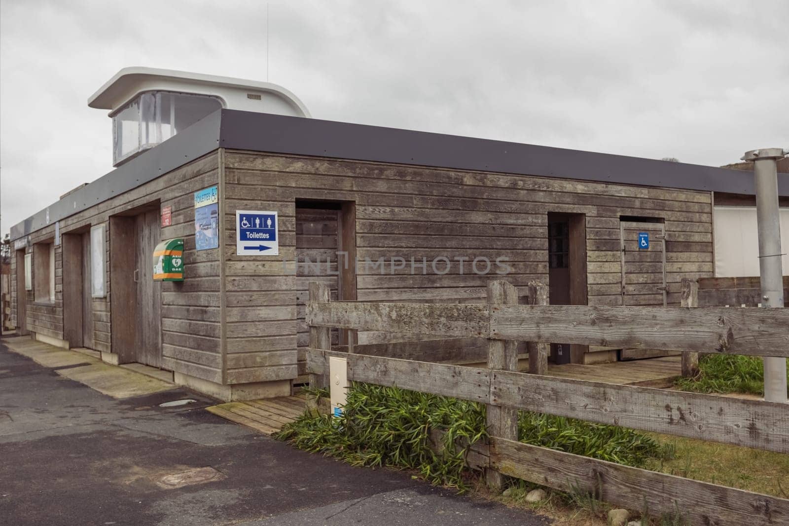 public toilet on the beach, wooden brown by PopOff