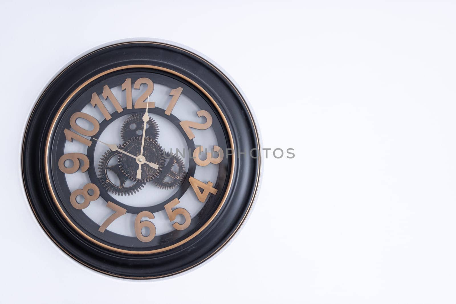 clock on the wall on a white background with space to the right by PopOff