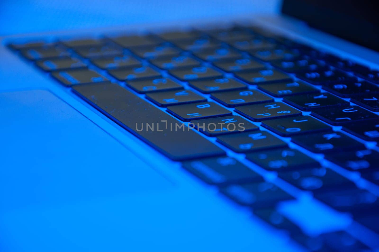 keyboard close-up with RGB backlight blurred background. High quality photo