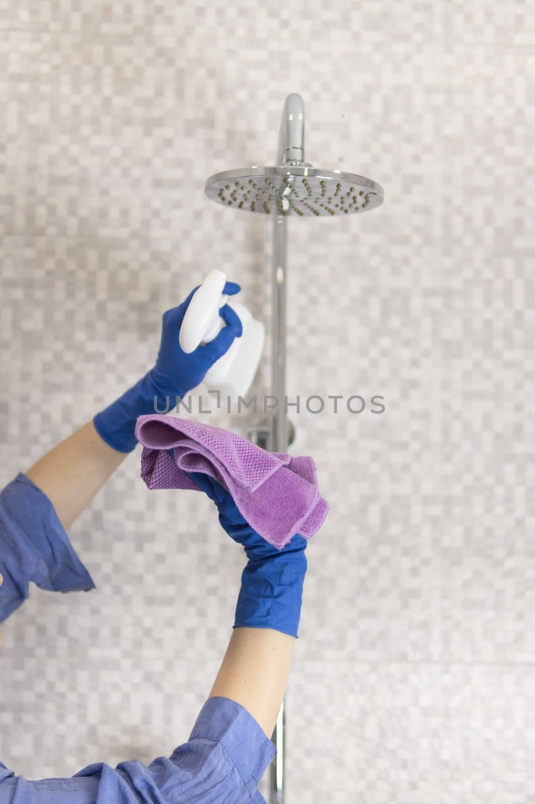 cleaning and washing the shower close-up of a girl's hand. High quality photo