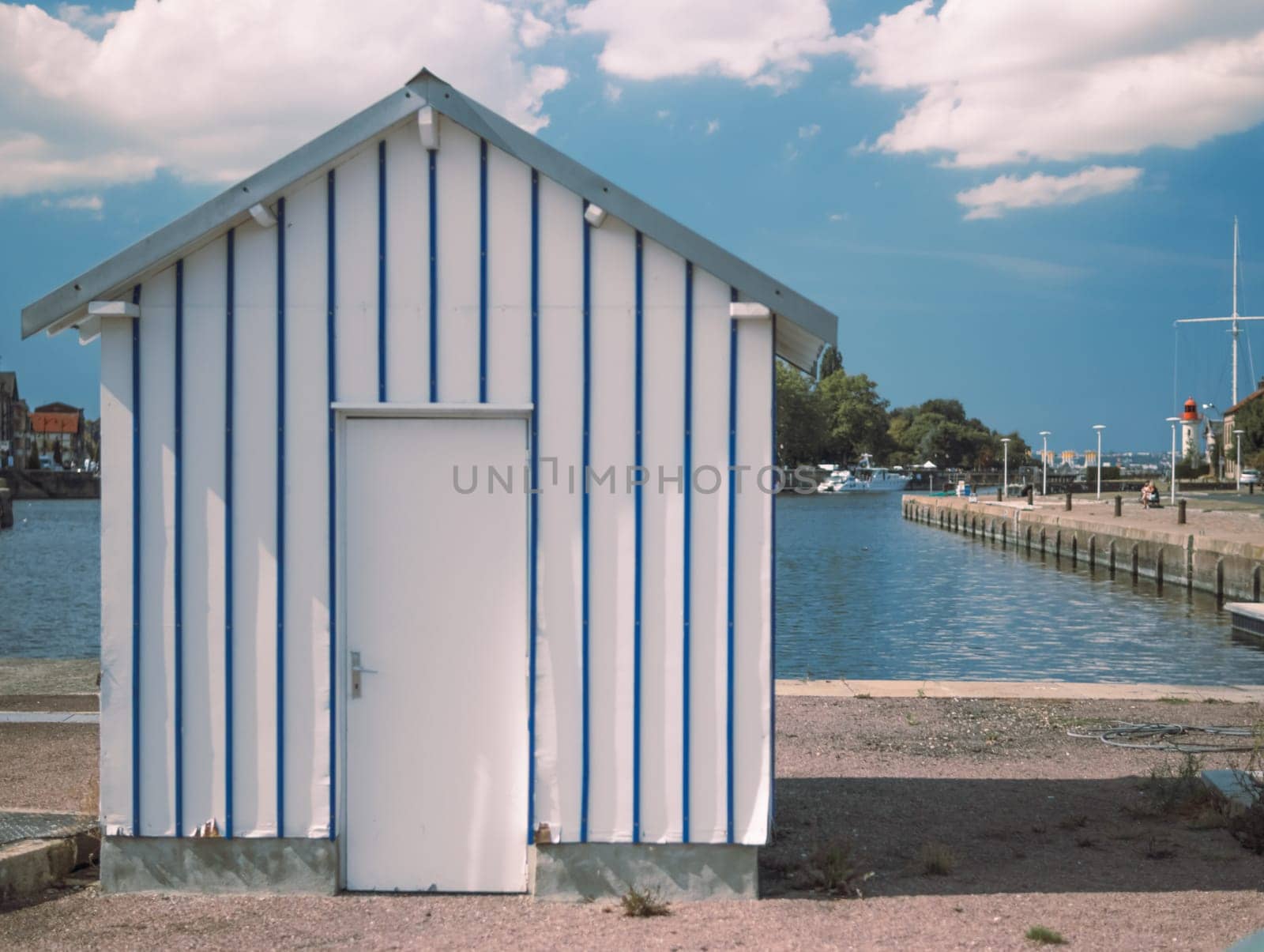 the house is small for security on the pier, near the sea.there is a place for an inscription in the port town. High quality photo