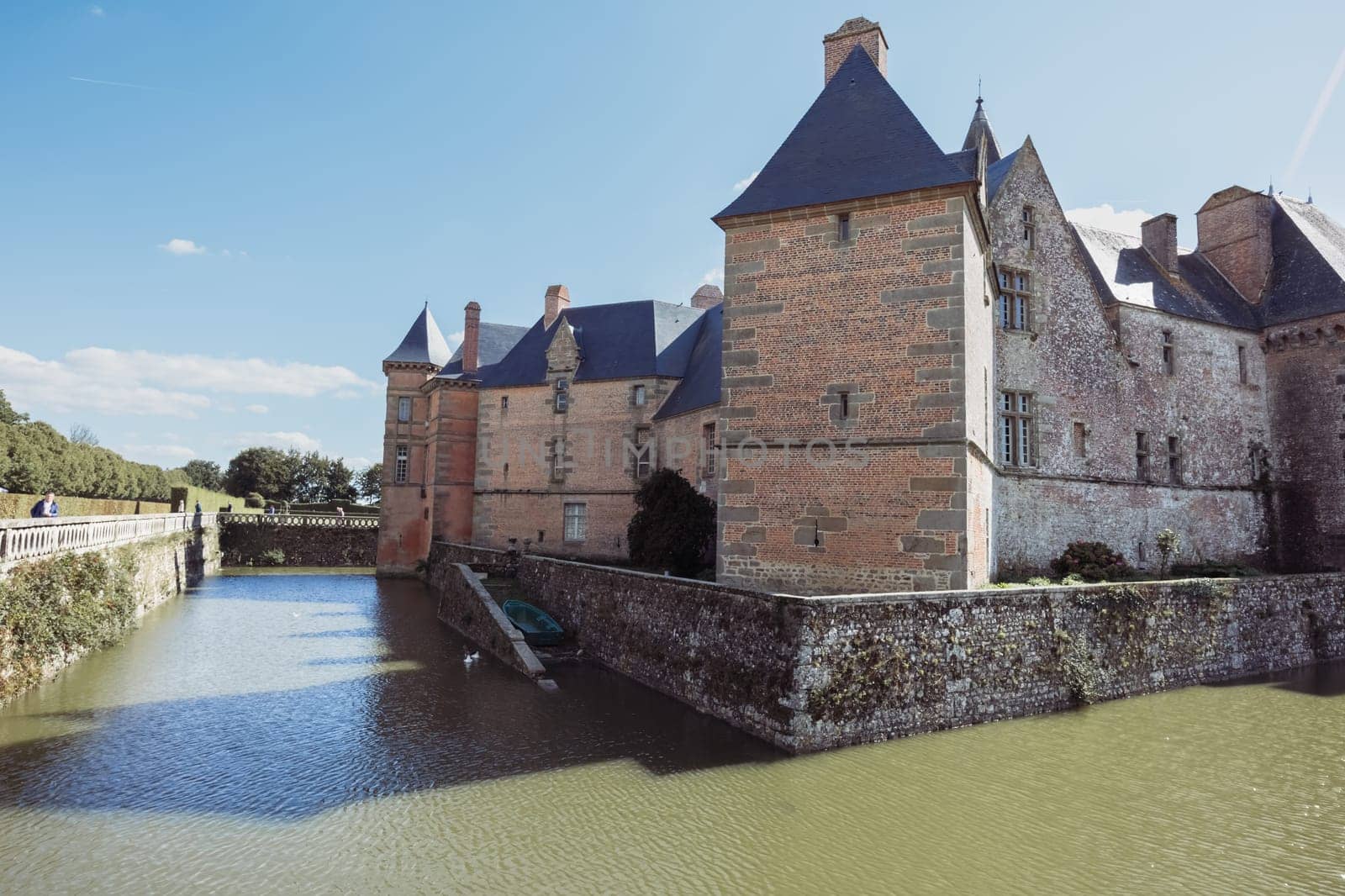 The ancient building of the chateau in France around the lake building, the building close-up has a place for the inscription. High quality photo