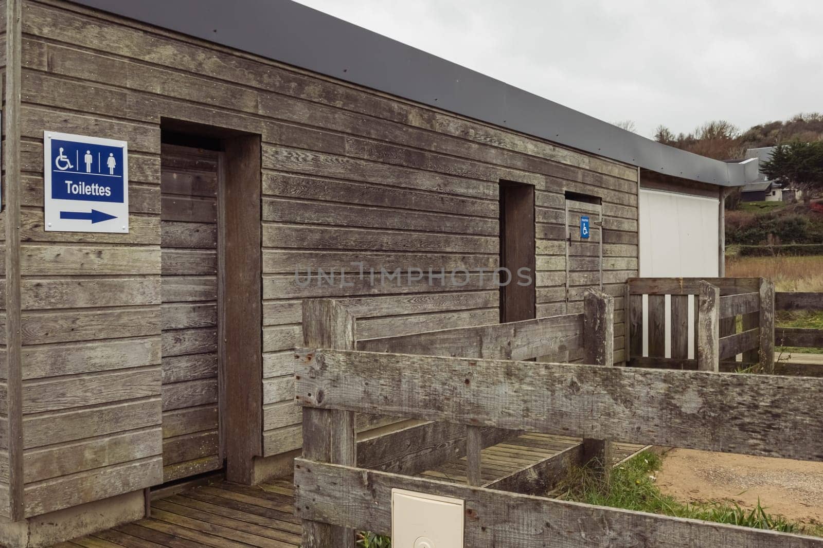 public toilet on the beach, wooden brown. High quality photo