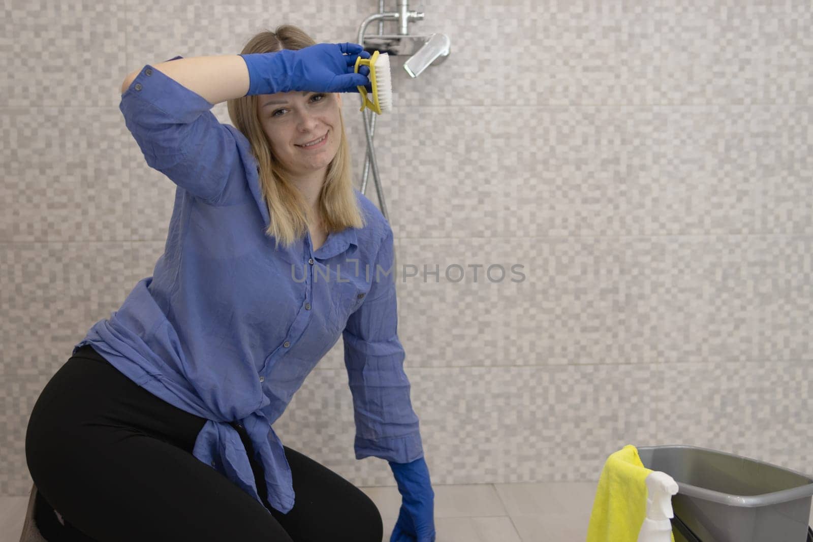 cleaning and washing the bathroom girl washes the tiles by PopOff