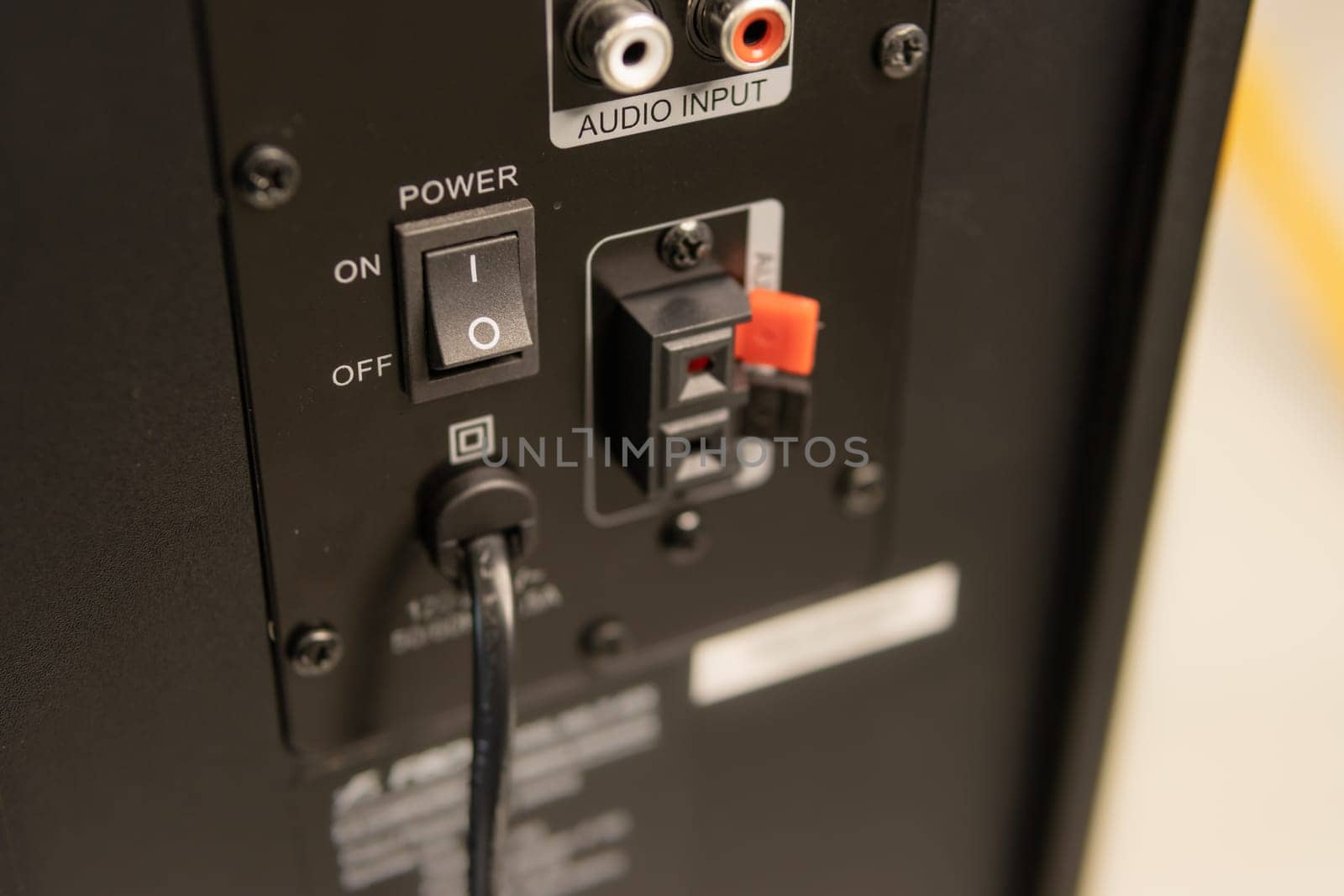Close-up of the speaker connectors on the back of the AV receiver. High quality photo
