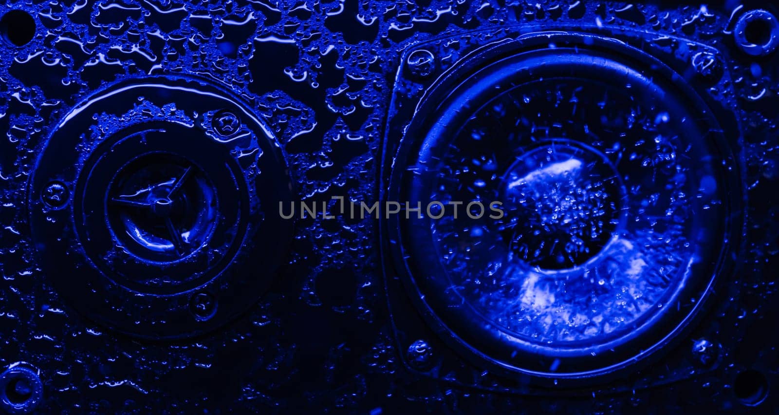 Abstract concept of powerful sound speaker in blue neon light an water by PopOff