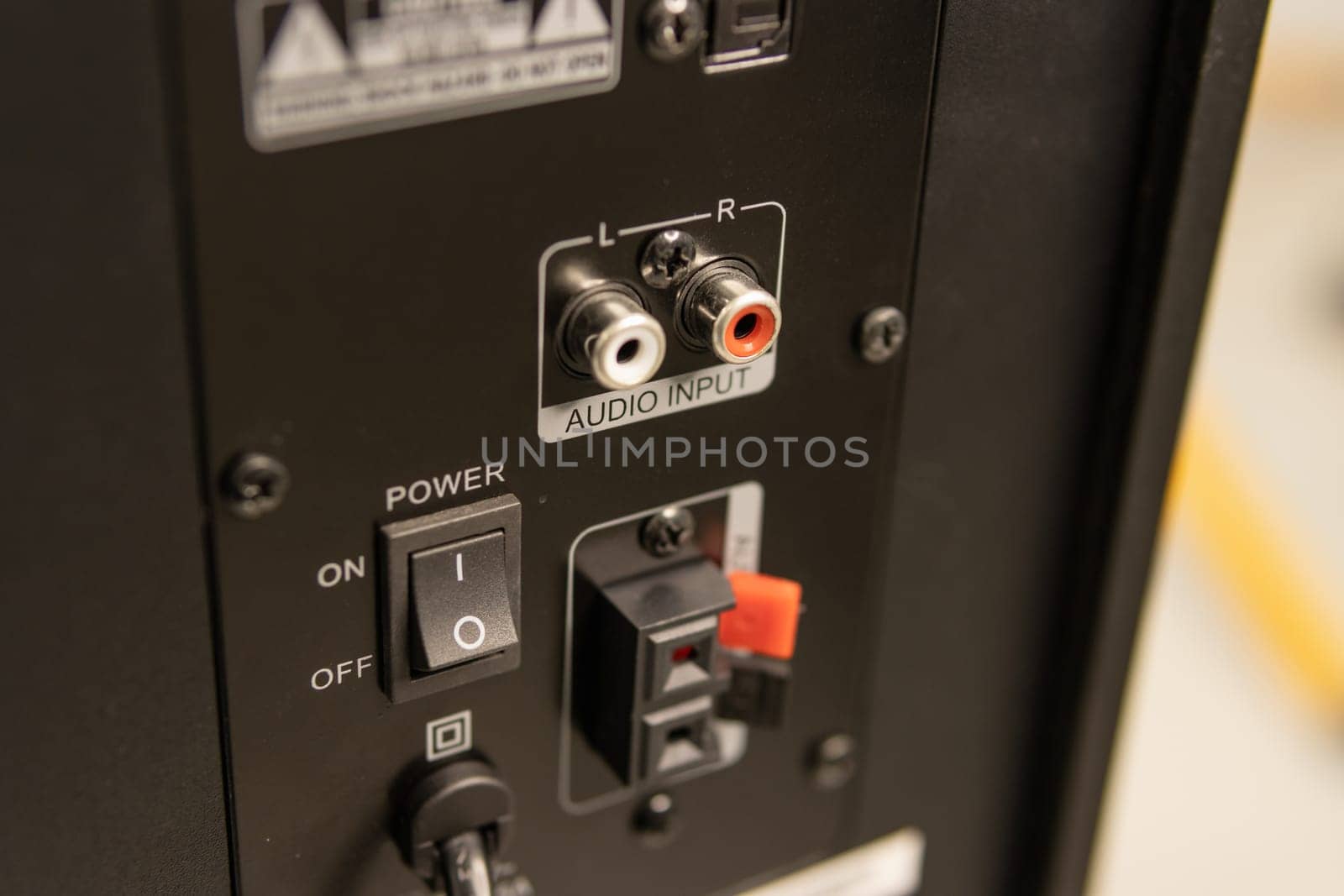 Close-up of the speaker connectors on the back of the AV receiver by PopOff