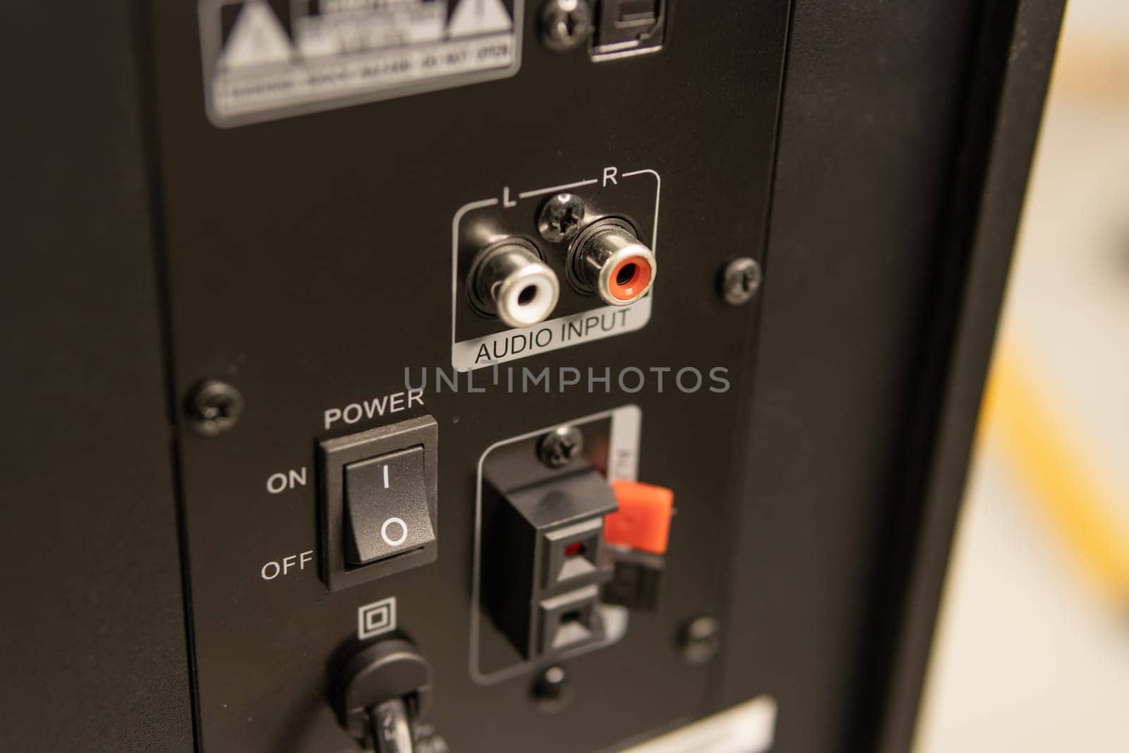 Close-up of the speaker connectors on the back of the AV receiver. High quality photo