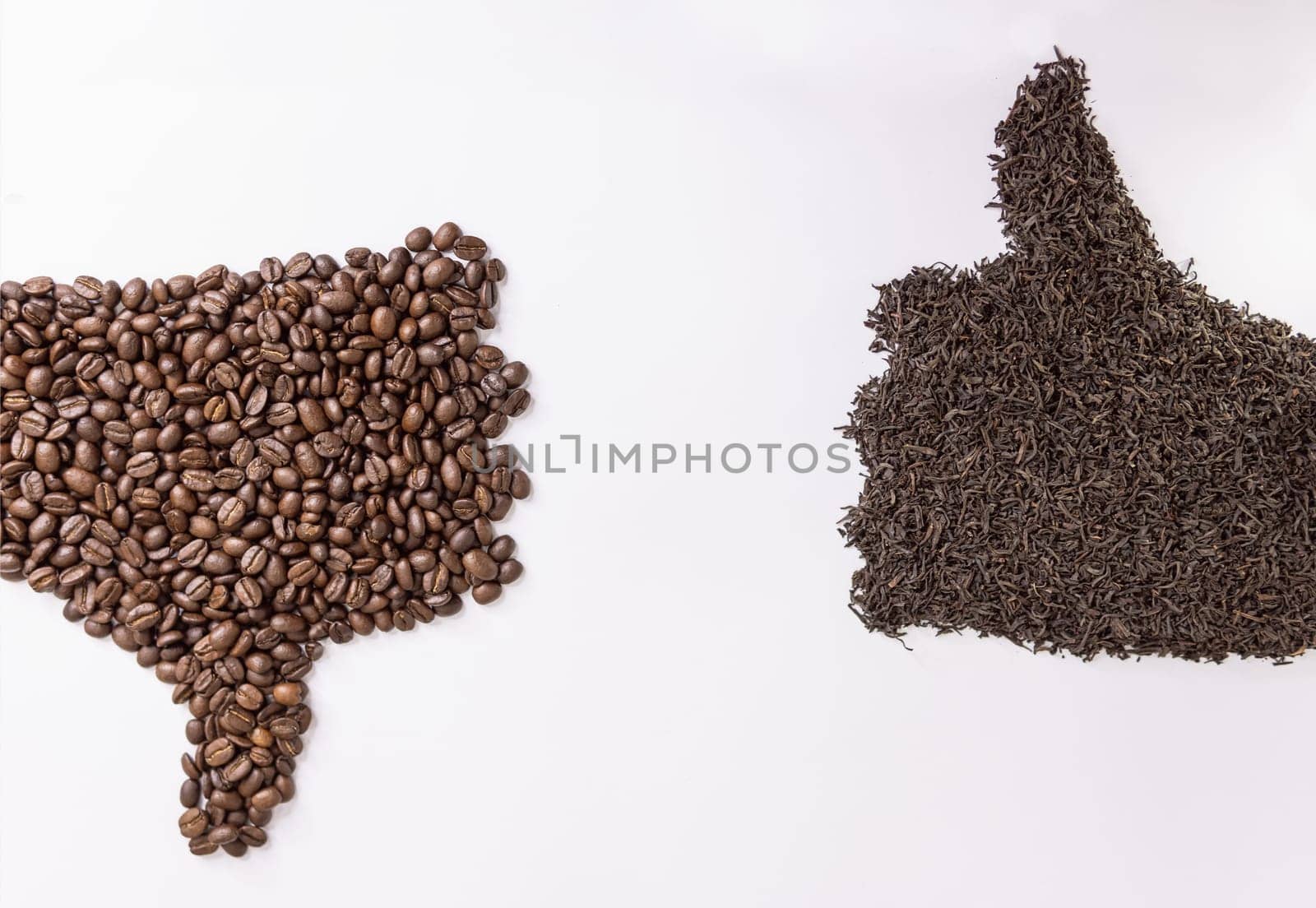 On a white background,human hands are lined with tea leaves and coffee. High quality photo