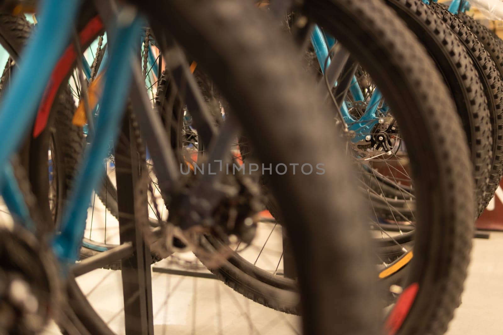 Wheels from a bicycle close-up. A lot of bicycles in the store. High quality photo