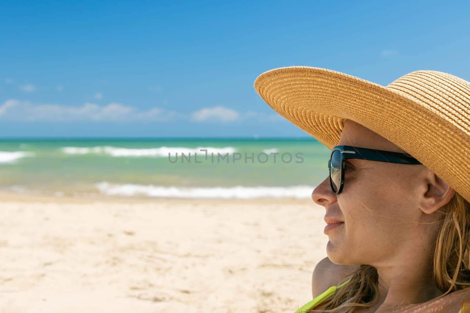 girl in a swimsuit on the seashore with glasses, there is a place for an inscription by PopOff