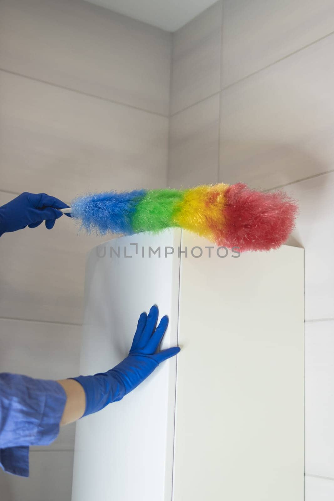 cleaning the bathroom girls hands in blue gloves cleaning concept. High quality photo