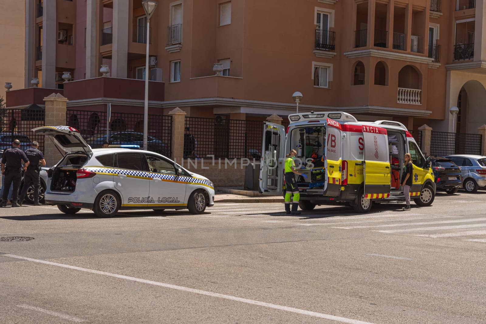 knocked down a man in the city on the road, Spain, Torrevieja on May 28, 2023, an ambulance on the road picks up a person injured by PopOff