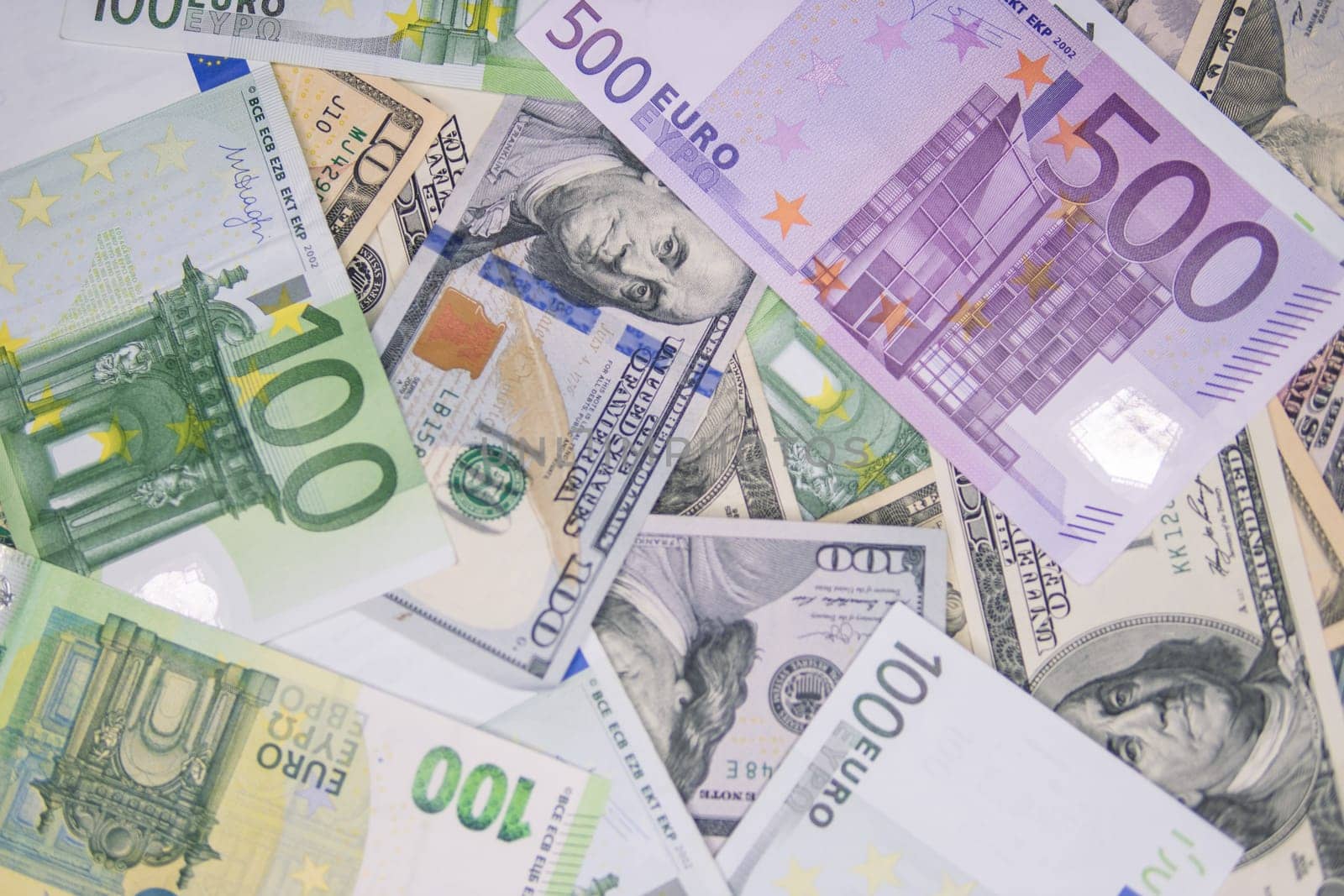 american and european currency dollars euro close up background by PopOff